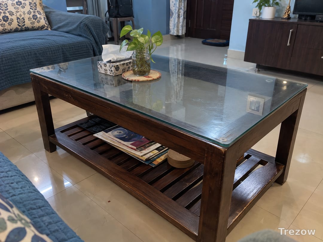 Glass-top wooden coffee table