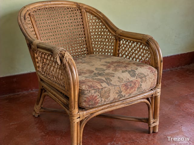 Cane armchair with cushion