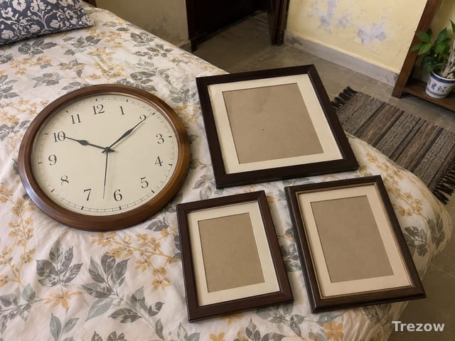 Wall clock with three photo frames