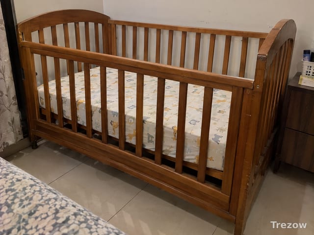 Wooden baby cot with mattress